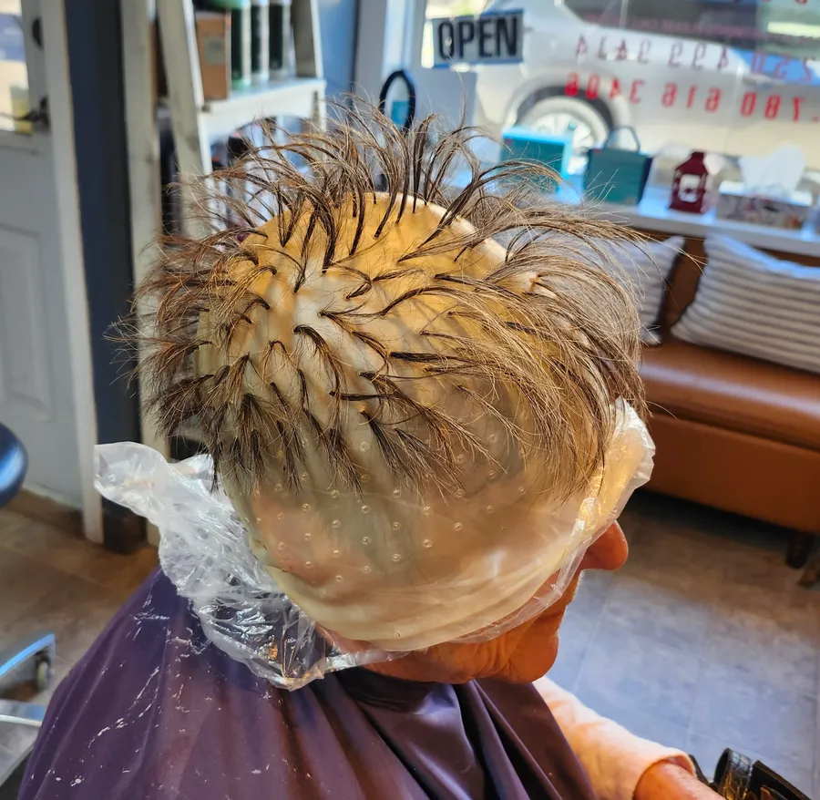 Highlights done the classic way, strands pulled through a cap and ready for colour